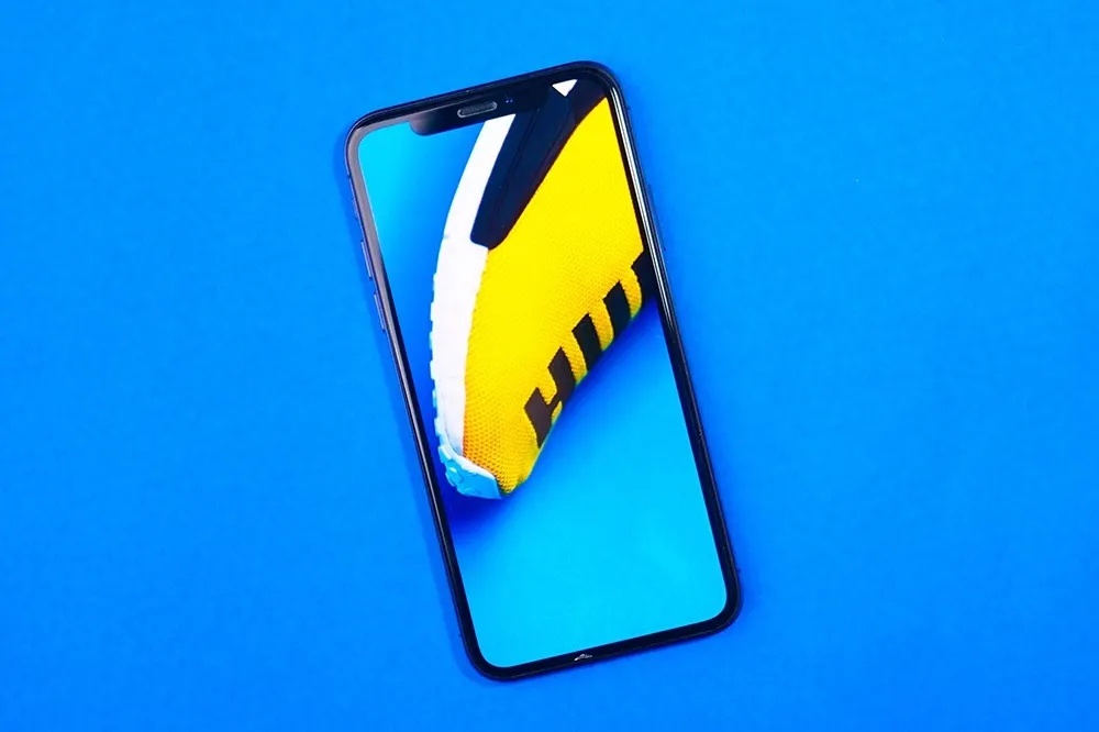 iphone with blue background behind it