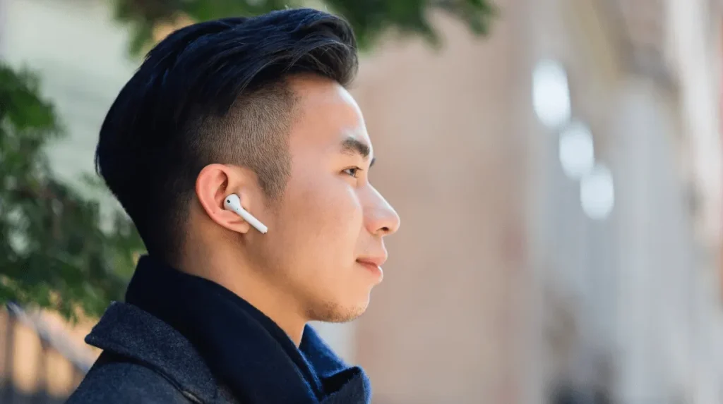 man with airpods in ear