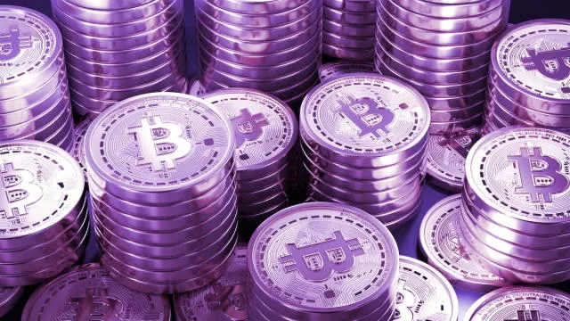 purple stacks of bitcoins