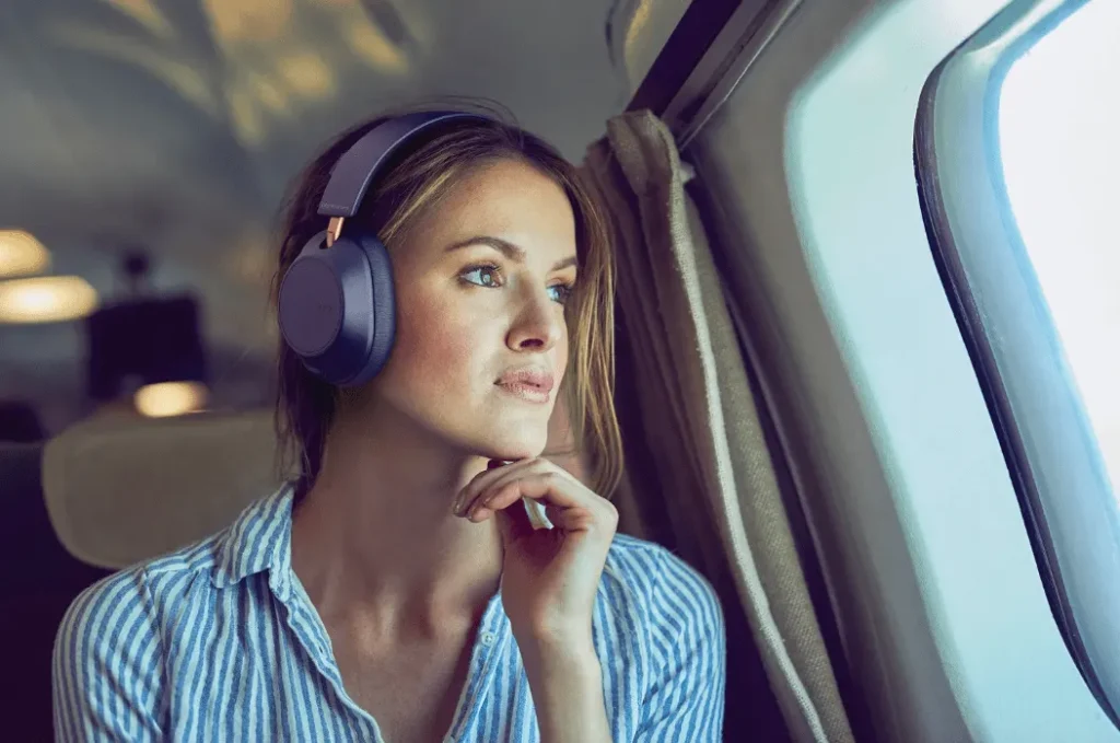 woman in car wearing headphones