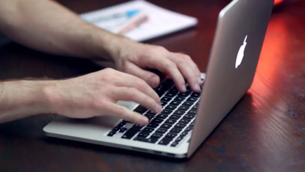 man using macbook