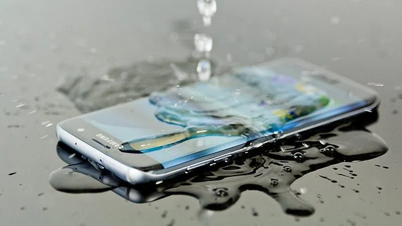 waterproof phone getting water poured on it